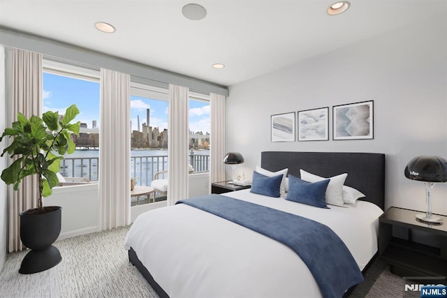 443 Albany Ct Unit 443, West New York, NJ 07093 - carpeted bedroom with access to outside, a water view, recessed lighting, and baseboards