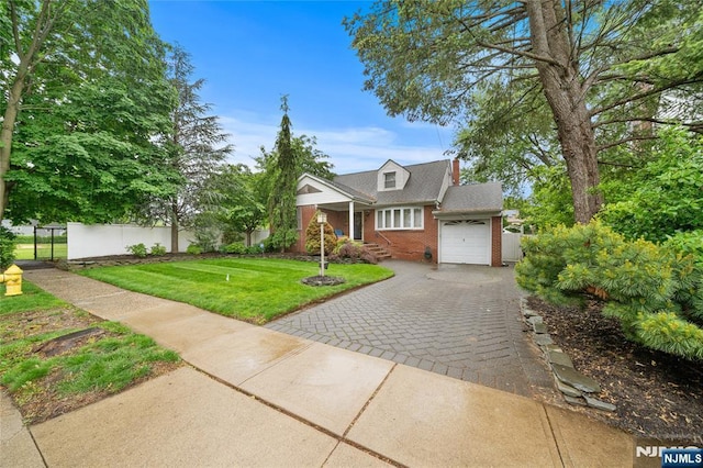 33 Irwin Pl, Bloomfield, NJ 07003 - view of front of property with brick siding, an attached garage, and decorative driveway