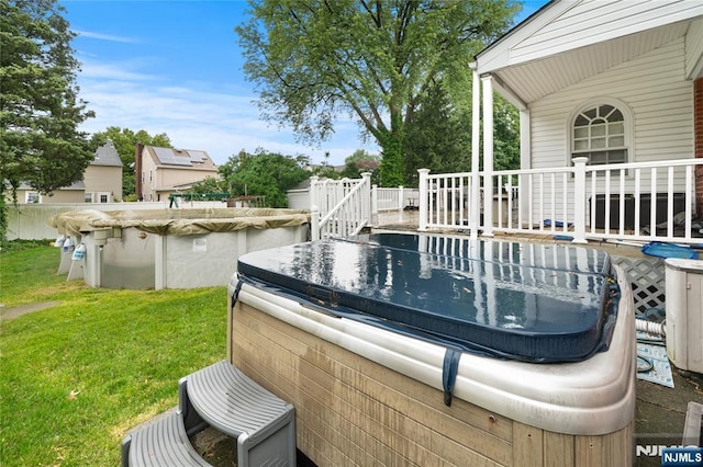 33 Irwin Pl, Bloomfield, NJ 07003 - wooden terrace featuring a hot tub, a covered pool, and a lawn