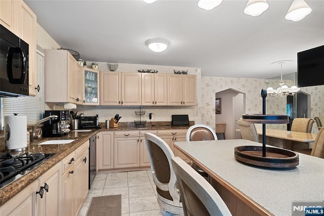 33 Irwin Pl, Bloomfield, NJ 07003 - kitchen with black appliances, a sink, arched walkways, glass insert cabinets, and wallpapered walls