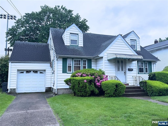 72 Washington Ave, Elmwood Park, NJ 07407 - cape cod-style house with an attached garage, a front yard, and asphalt driveway