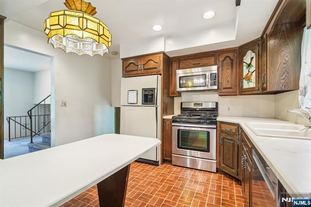 69 Bogert Pl, Bergenfield, NJ 07621 - kitchen with appliances with stainless steel finishes, a sink, brick patterned flooring, light countertops, and recessed lighting