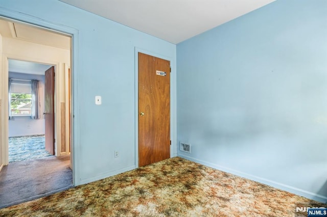 69 Bogert Pl, Bergenfield, NJ 07621 - unfurnished bedroom featuring carpet floors, baseboards, and attic access