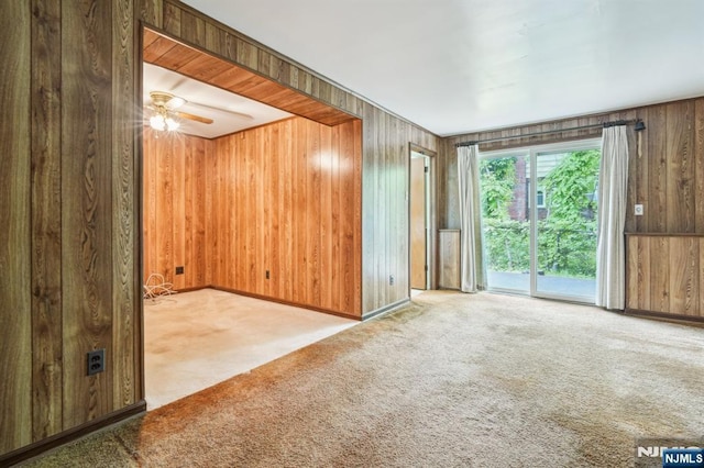 69 Bogert Pl, Bergenfield, NJ 07621 - unfurnished room featuring carpet, wood walls, a ceiling fan, and baseboards