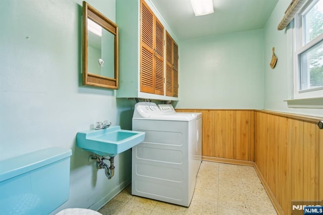 69 Bogert Pl, Bergenfield, NJ 07621 - washroom with washer and dryer, light flooring, wainscoting, and wooden walls