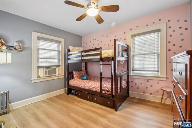 24 Willet, Bloomfield, NJ 07003 - bedroom featuring light wood-type flooring, radiator, baseboards, cooling unit, and wallpapered walls