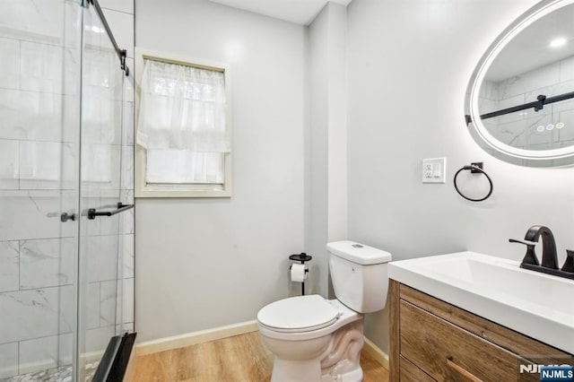 24 Willet, Bloomfield, NJ 07003 - bathroom featuring toilet, vanity, a stall shower, and wood finished floors