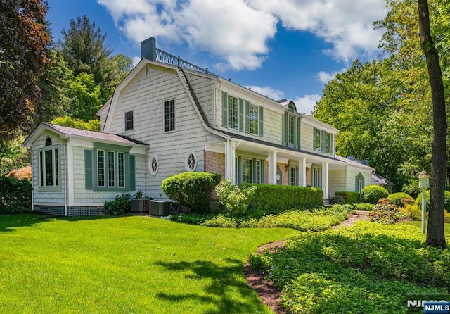 2 Olde Lantern Ct, Montvale, NJ 07645 - rear view of property with a chimney, a yard, a gambrel roof, and central AC unit
