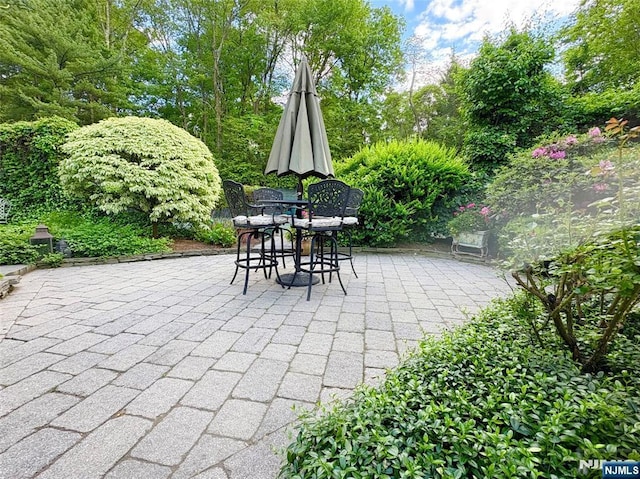 2 Olde Lantern Ct, Montvale, NJ 07645 - view of patio featuring outdoor dining space and view of scattered trees