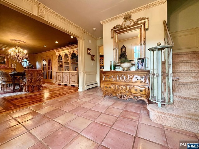 2 Olde Lantern Ct, Montvale, NJ 07645 - entryway featuring a decorative wall, a baseboard radiator, a chandelier, wainscoting, and stairway