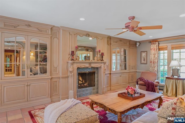 2 Olde Lantern Ct, Montvale, NJ 07645 - living area featuring a ceiling fan, a tile fireplace, ornamental molding, recessed lighting, and a decorative wall