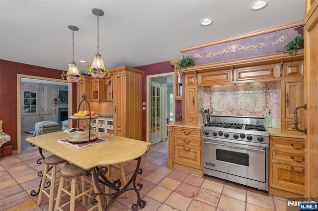 2 Olde Lantern Ct, Montvale, NJ 07645 - kitchen with luxury stove, recessed lighting, a chandelier, light countertops, and pendant lighting