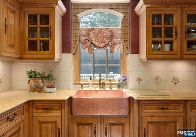 2 Olde Lantern Ct, Montvale, NJ 07645 - kitchen with light countertops, glass insert cabinets, decorative backsplash, and brown cabinetry
