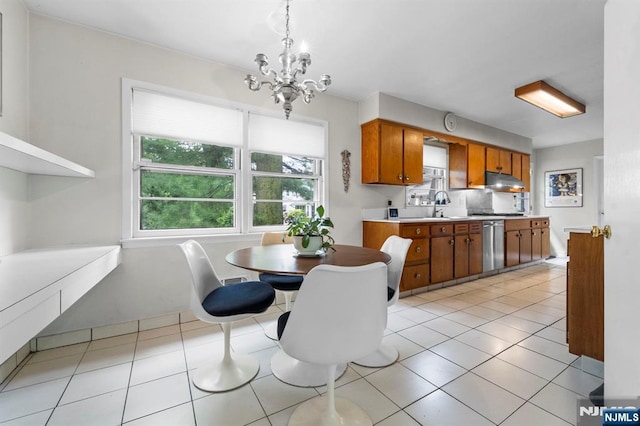 430 Jones Rd, Englewood, NJ 07631 - dining area with a chandelier and light tile patterned floors