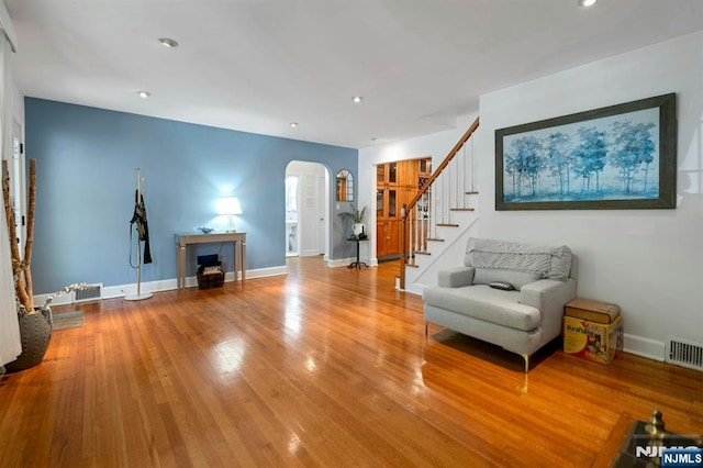 21 Sheridan Ave, West Orange, NJ 07052 - living area with arched walkways, stairs, wood finished floors, baseboards, and recessed lighting