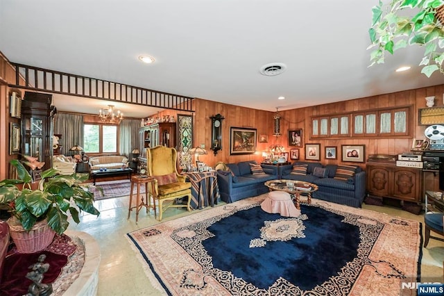 379 Mauro Rd, Englewood Cliffs, NJ 07632 - living room featuring a chandelier, wooden walls, and recessed lighting
