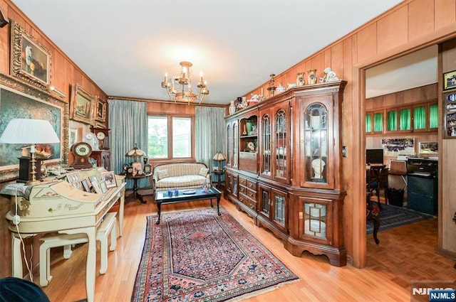379 Mauro Rd, Englewood Cliffs, NJ 07632 - office featuring a chandelier, wooden walls, light wood-style floors, and ornamental molding