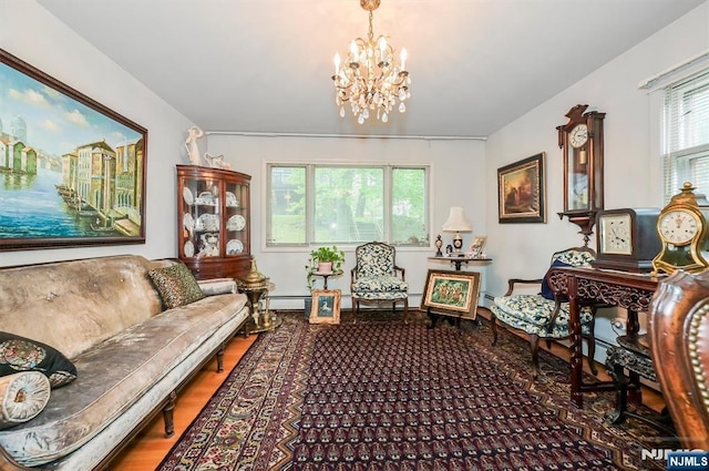 379 Mauro Rd, Englewood Cliffs, NJ 07632 - living area with a chandelier, wood finished floors, and a baseboard radiator