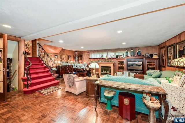 379 Mauro Rd, Englewood Cliffs, NJ 07632 - living room featuring stairs, wooden walls, and recessed lighting