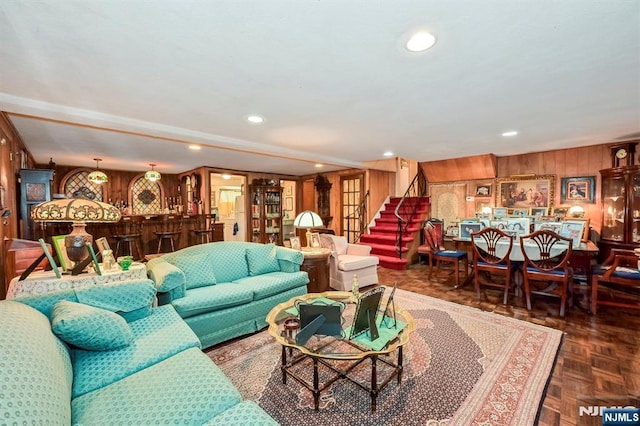 379 Mauro Rd, Englewood Cliffs, NJ 07632 - living area with a bar, wooden walls, and stairway