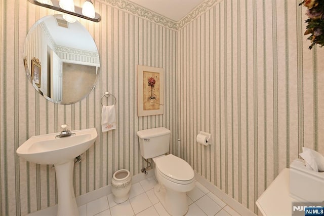 54 Hunter Rd, North Haledon, NJ 07508 - bathroom featuring tile patterned flooring, toilet, baseboards, wallpapered walls, and a sink