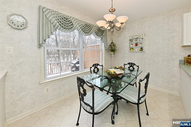 54 Hunter Rd, North Haledon, NJ 07508 - dining area featuring a chandelier, baseboards, and tile patterned flooring
