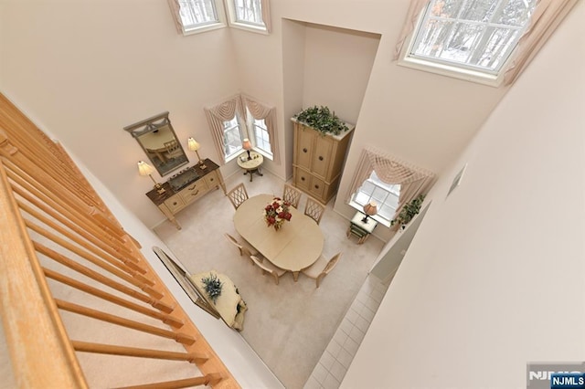 54 Hunter Rd, North Haledon, NJ 07508 - living room with a high ceiling, stairway, and carpet