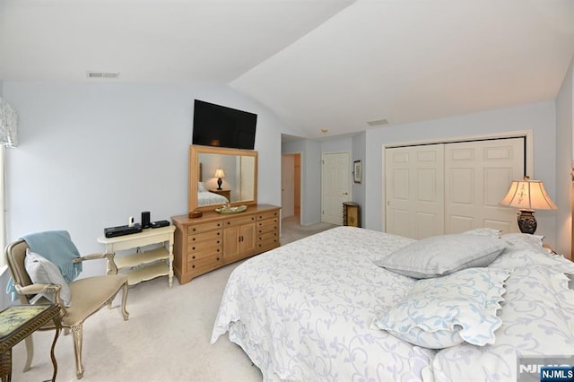 54 Hunter Rd, North Haledon, NJ 07508 - bedroom with light colored carpet, vaulted ceiling, and a closet