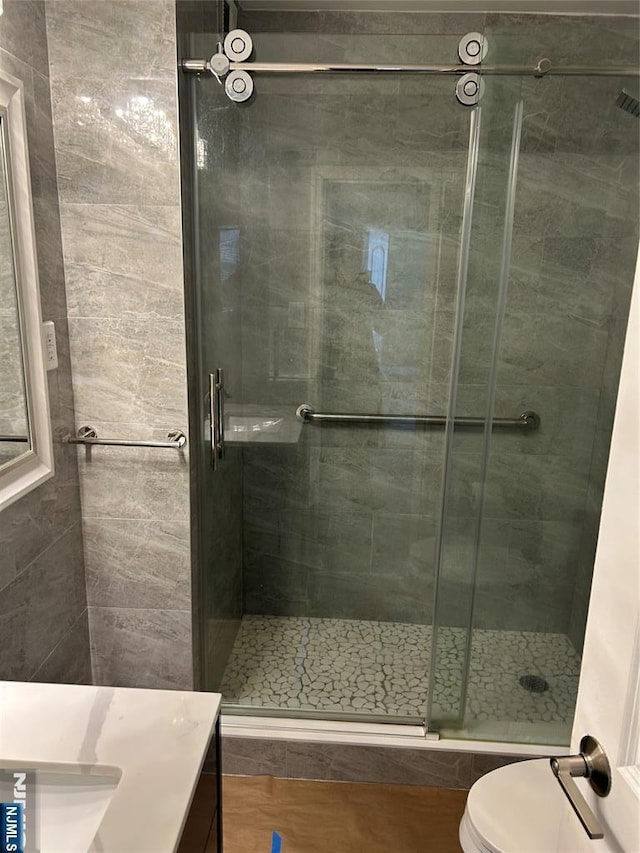 276 Prospect Unit 3H, East Orange, NJ 07017 - full bathroom with vanity, a shower stall, and toilet