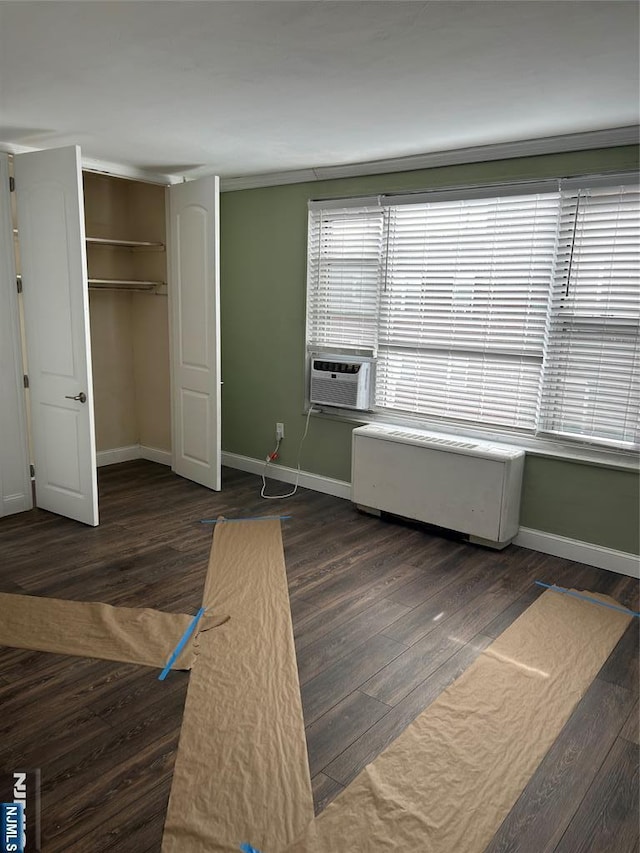 276 Prospect Unit 3H, East Orange, NJ 07017 - unfurnished bedroom featuring baseboards, cooling unit, and wood finished floors