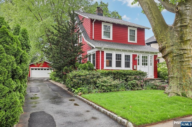 5 Laurel Pl, Glen Ridge, NJ 07028 - view of front of home featuring an outdoor structure, a chimney, a garage, roof with shingles, and a front yard