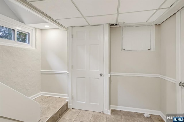 5 Laurel Pl, Glen Ridge, NJ 07028 - basement featuring a drop ceiling, baseboards, and light tile patterned floors