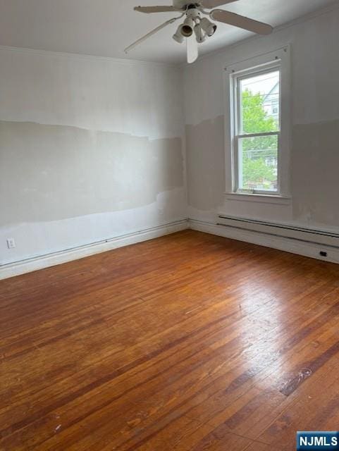 457 7th St, Newark, NJ 07107 - empty room with hardwood / wood-style floors, a ceiling fan, a baseboard heating unit, and crown molding