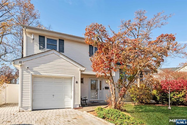 8 Carlisle Ct, Edison, NJ 08817 - view of front of home with decorative driveway and an attached garage