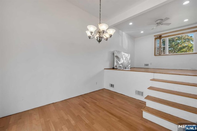 8 Carlisle Ct, Edison, NJ 08817 - unfurnished dining area with wood finished floors, a chandelier, recessed lighting, beamed ceiling, and a ceiling fan