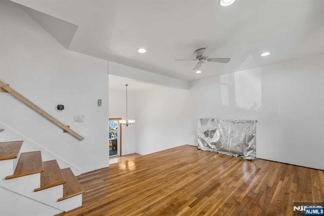 8 Carlisle Ct, Edison, NJ 08817 - unfurnished room with stairs, a ceiling fan, wood finished floors, recessed lighting, and a chandelier