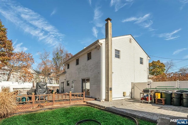 8 Carlisle Ct, Edison, NJ 08817 - rear view of property with a wooden deck and a patio