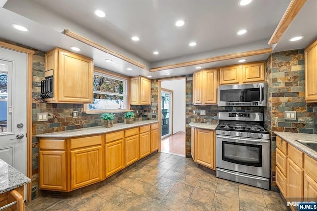 8 Carlisle Ct, Edison, NJ 08817 - kitchen featuring appliances with stainless steel finishes, tasteful backsplash, a raised ceiling, recessed lighting, and stone finish floors