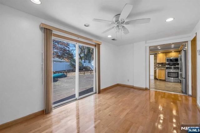 8 Carlisle Ct, Edison, NJ 08817 - unfurnished living room with baseboards, a ceiling fan, light wood-type flooring, and recessed lighting