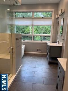 625 Roberge Dr, River Vale, NJ 07675 - full bath with vanity, a shower stall, stone tile floors, a freestanding bath, and recessed lighting
