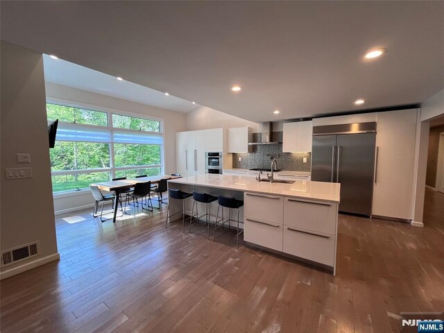 625 Roberge Dr, River Vale, NJ 07675 - kitchen with stainless steel appliances, modern cabinets, a sink, dark wood-style floors, and recessed lighting