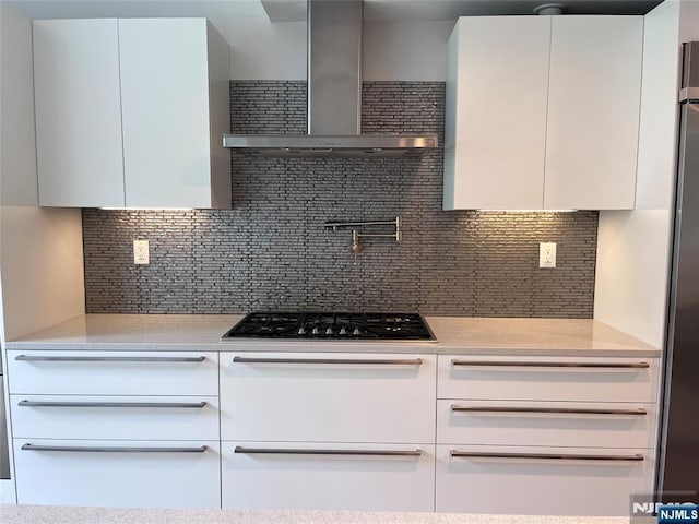 625 Roberge Dr, River Vale, NJ 07675 - kitchen with modern cabinets, wall chimney exhaust hood, white cabinets, and decorative backsplash