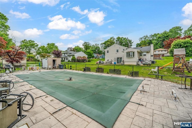 415 Briarwood Ln, Northvale, NJ 07647 - view of swimming pool featuring a playground, a residential view, and a patio area