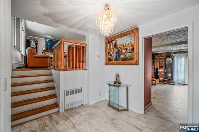 415 Briarwood Ln, Northvale, NJ 07647 - stairs with radiator heating unit and a chandelier