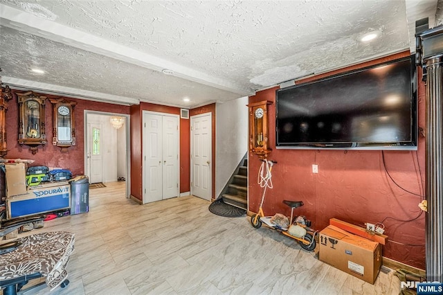415 Briarwood Ln, Northvale, NJ 07647 - living area featuring stairway, baseboards, a textured ceiling, and recessed lighting