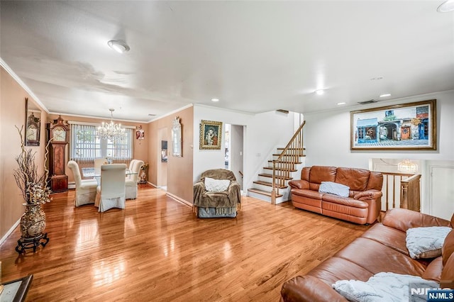 415 Briarwood Ln, Northvale, NJ 07647 - living room with ornamental molding, a chandelier, light wood finished floors, baseboards, and stairway