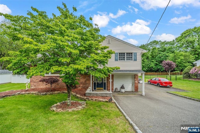 415 Briarwood Ln, Northvale, NJ 07647 - view of front facade with brick siding, driveway, and a garage