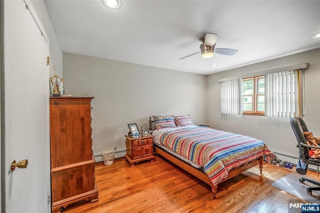 415 Briarwood Ln, Northvale, NJ 07647 - bedroom with light wood finished floors, a baseboard radiator, a ceiling fan, and recessed lighting