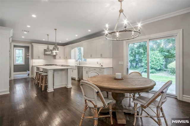 77 Ross Ave, Demarest, NJ 07627 - dining area with a chandelier, crown molding, dark wood-style floors, baseboards, and recessed lighting