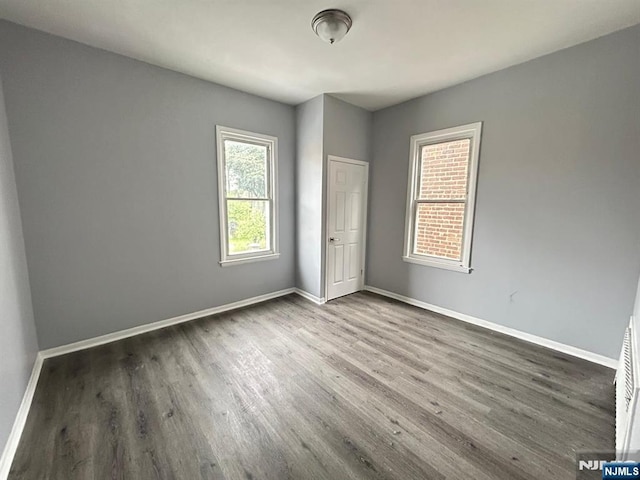 207 Tremont Ave, East Orange, NJ 07018 - unfurnished bedroom with wood finished floors and baseboards